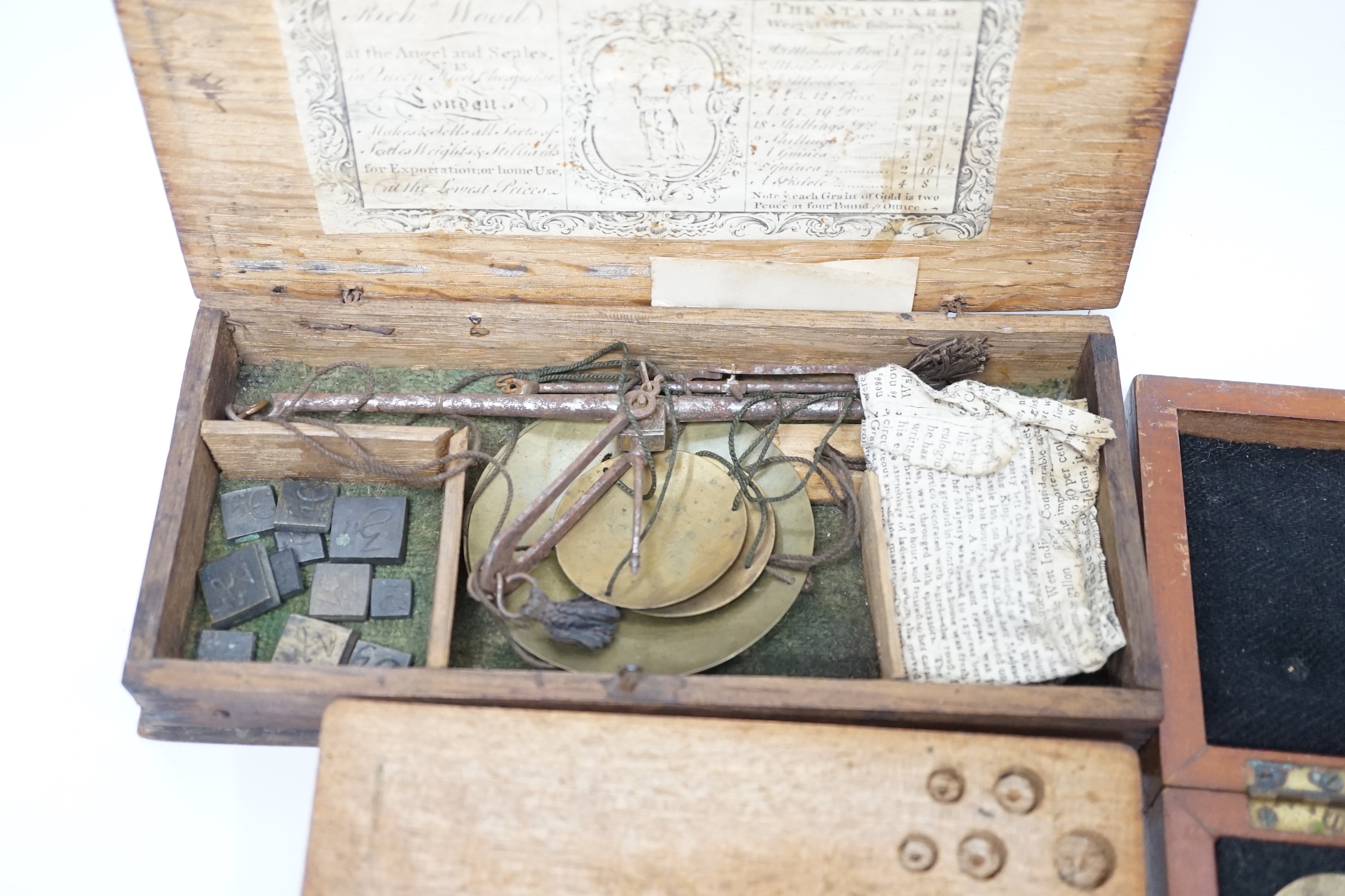 Four cased weighing sets, three of the sets with small scales included